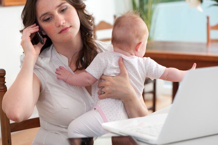 Mother Trying To Take A call with Baby-