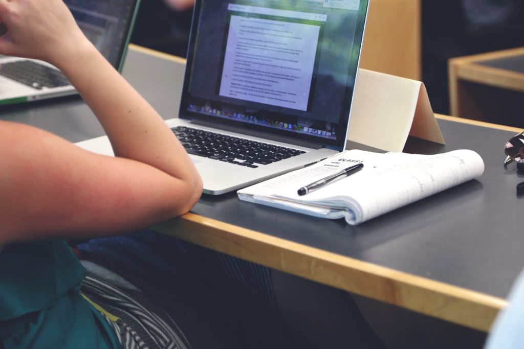 Working Mother With Baby Studying