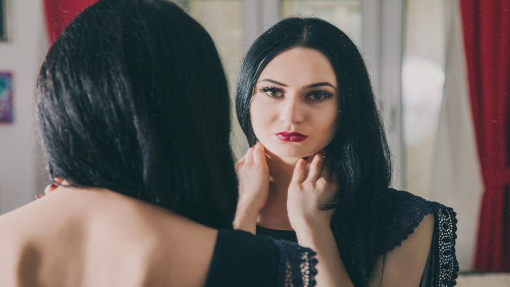 Lady looking at mirror