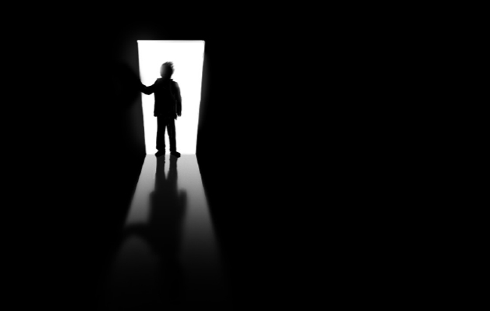Child in a dark room